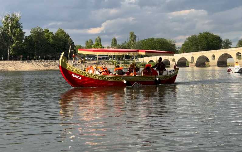 Traditional Ottoman-style boat on the Maritza River in Edirne with passengers aboard