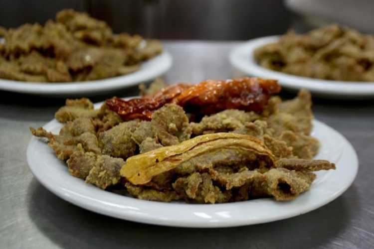 Fried liver (tava ciğeri) served on a plate in Edirne, Turkey