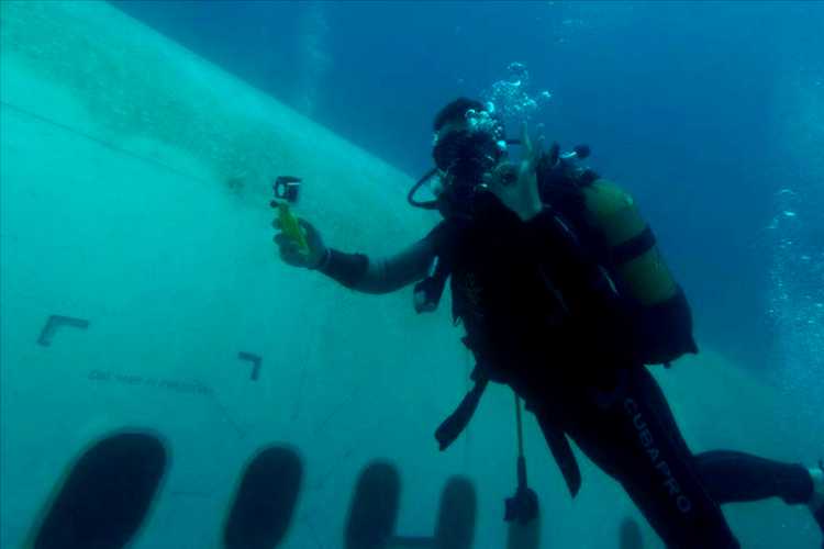 Scuba diver exploring the Airbus A330 wreck beneath the waters of Saros Gulf near İbrice Harbor