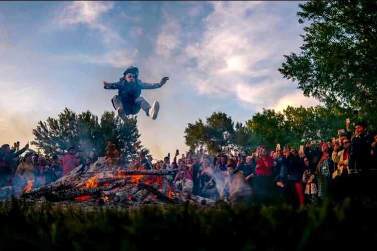 A participant jumping over the traditional Kakava bonfire during the spring festival in Edirne
