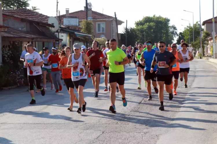 Runners competing in the 10th International Edirne Marathon on a side street in Edirne