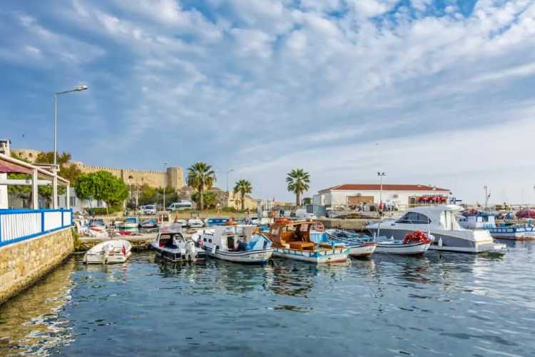 View of Bozcaada from the island port with boats and waterfront in Turkey