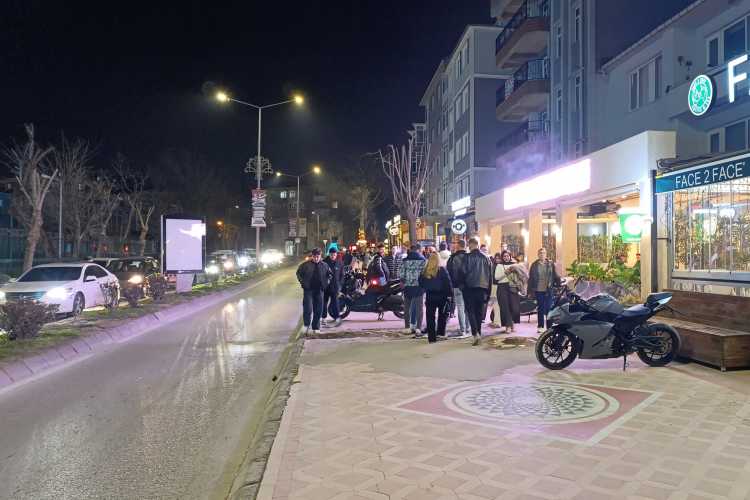 Pedestrian view of Bahriye Üçok Street in Edirne, showing cafés on the right and young people walking along the street