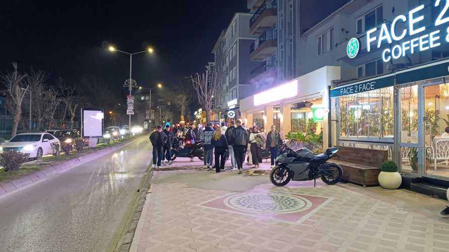 Young people strolling past cafés on the right-hand side of Bahriye Üçok Street, Edirne