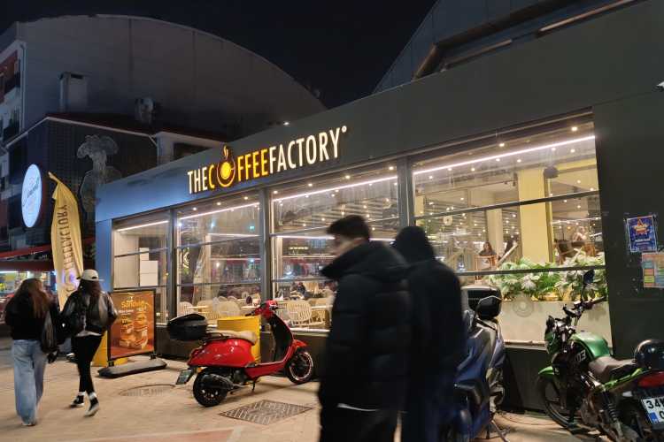 Street view of The Coffee Factory café in Edirne, showing the entrance and people outside