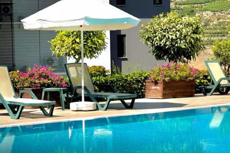 Partial view of a Fethiye villa and pool, illustrating residential properties subject to rental income declaration in Turkey.