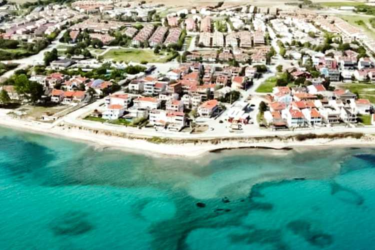 Aerial view of Yayla Beach in Saros Bay showing wide sandy coastline and clear blue sea