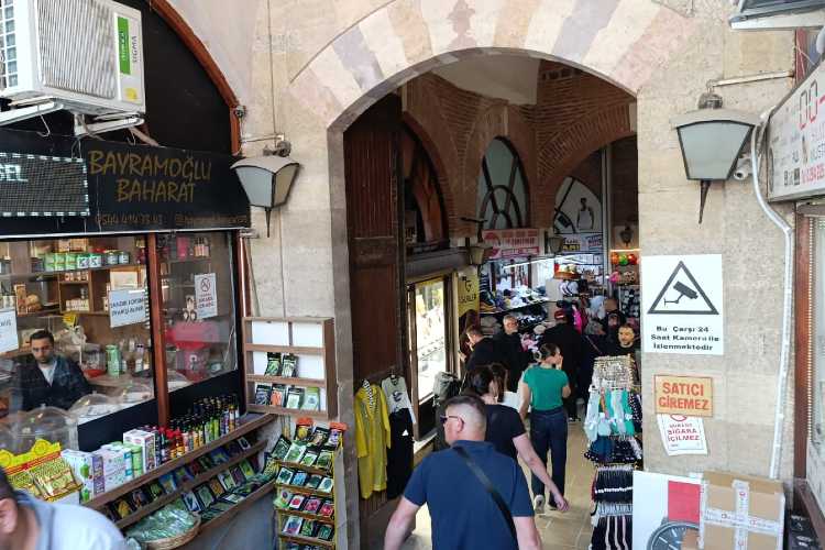 Entrance to Ali Paşa Bazaar in Edirne with people entering the historic Ottoman covered market
