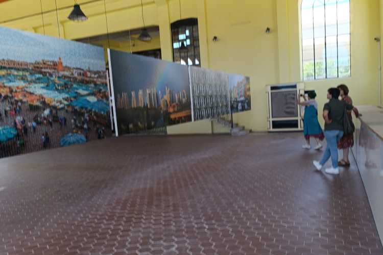Three women viewing contemporary artworks inside the Old Electricity Building during Edirne Bienali 2026