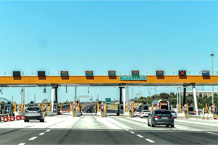 Vehicles approaching an HGS electronic toll bridge in Turkey