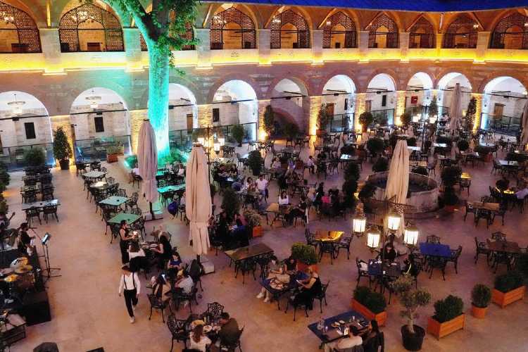 Rüstempaşa Kervansaray courtyard in Edirne, open-air view with illuminated arches at night